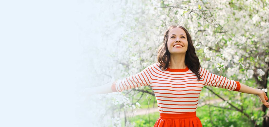 Woman enjoying spring outdoors, representing allergy care and treatment from an allergist in Lawrenceville, NJ.