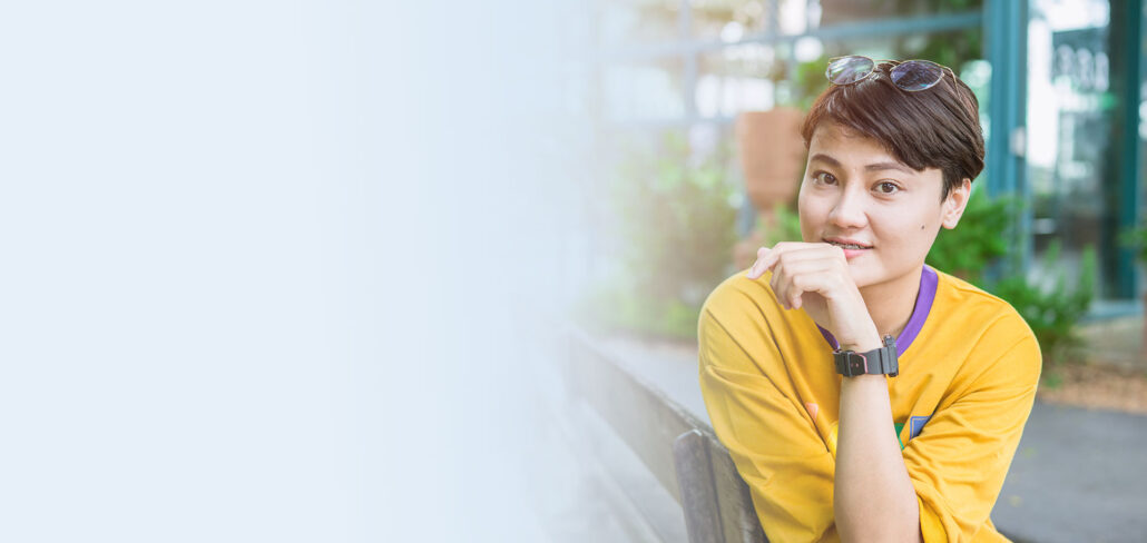 Gender-diverse person representing gender-affirming voice care and personalized voice therapy support.