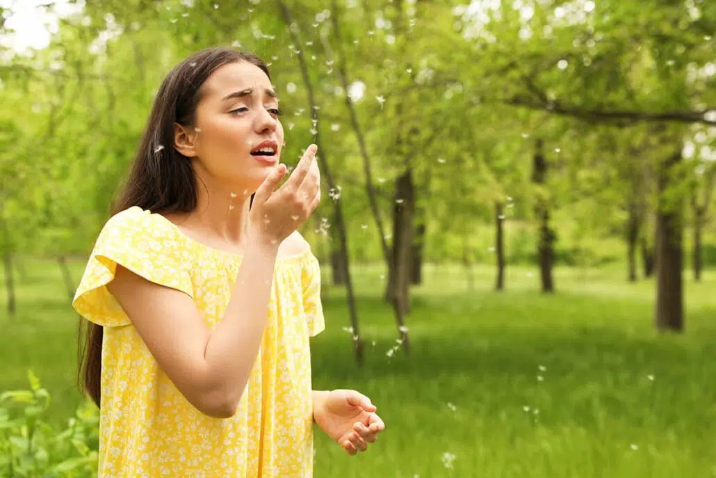 Woman suffering from seasonal allergies.