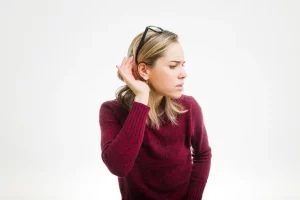 Sinus infections can lead to temporary hearing loss by blocking the Eustachian tube, affecting ear pressure and sound transmission.