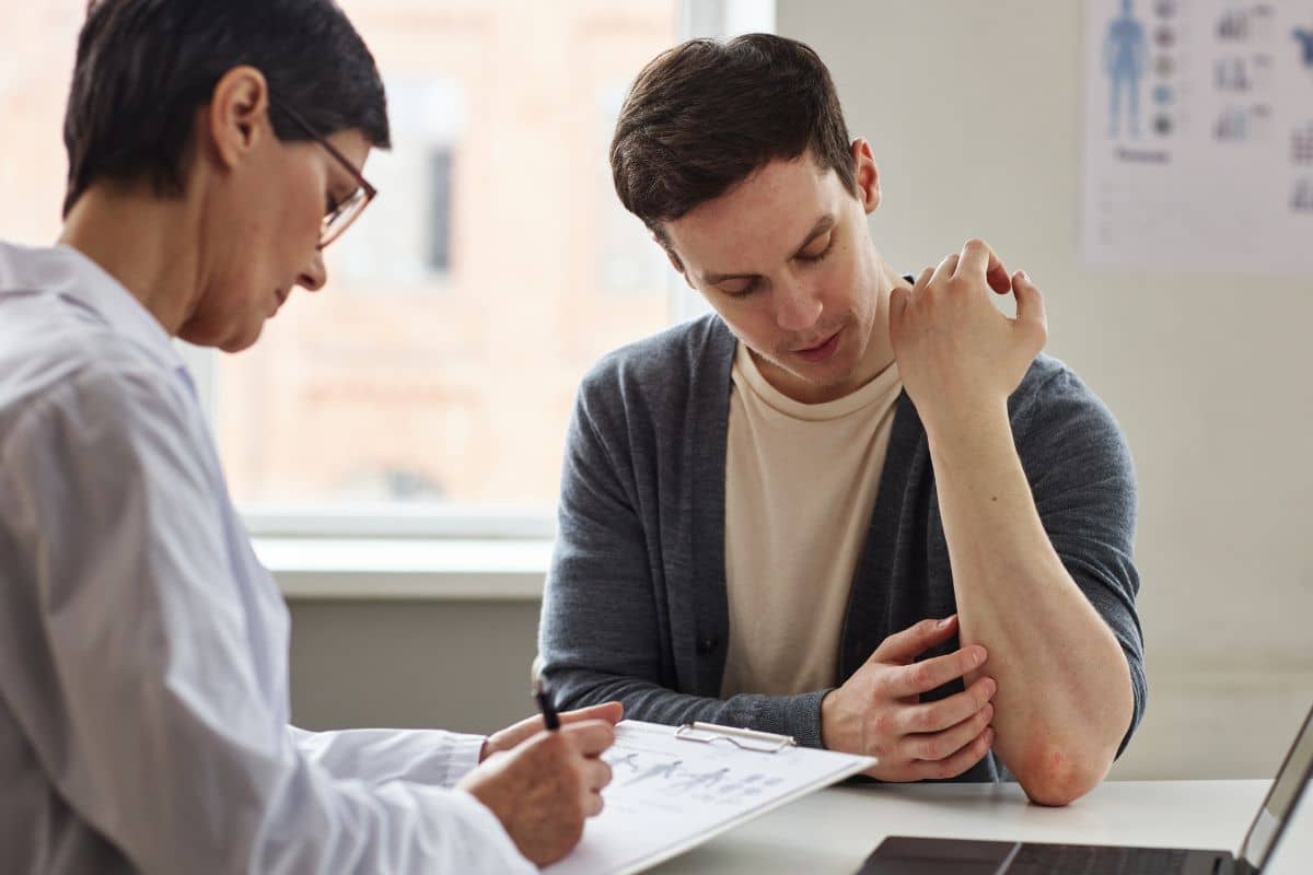 Patient consulting an allergy specialist about treatment options for pollen allergies at a medical clinic.