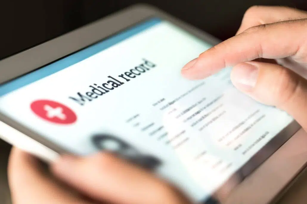 Digital medical record on tablet screen, organizing health information.