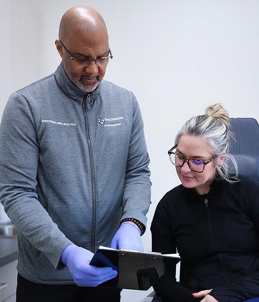Doctor reviewing sleep disorder treatment plan with patient during clinic consultation to improve sleep health