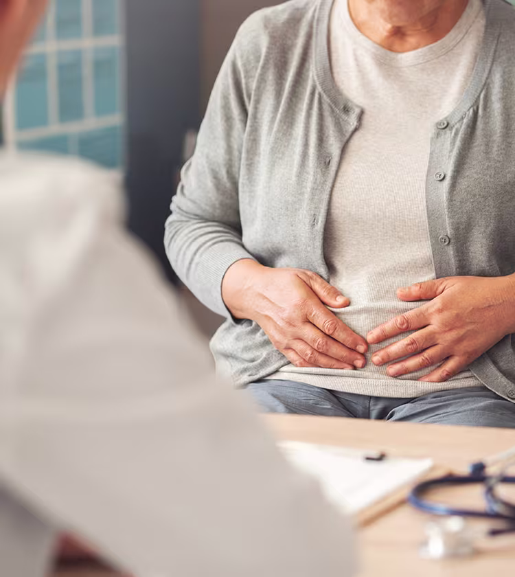 Patient discussing laryngopharyngeal reflux symptoms with ENT specialist during consultation for diagnosis and treatment options.