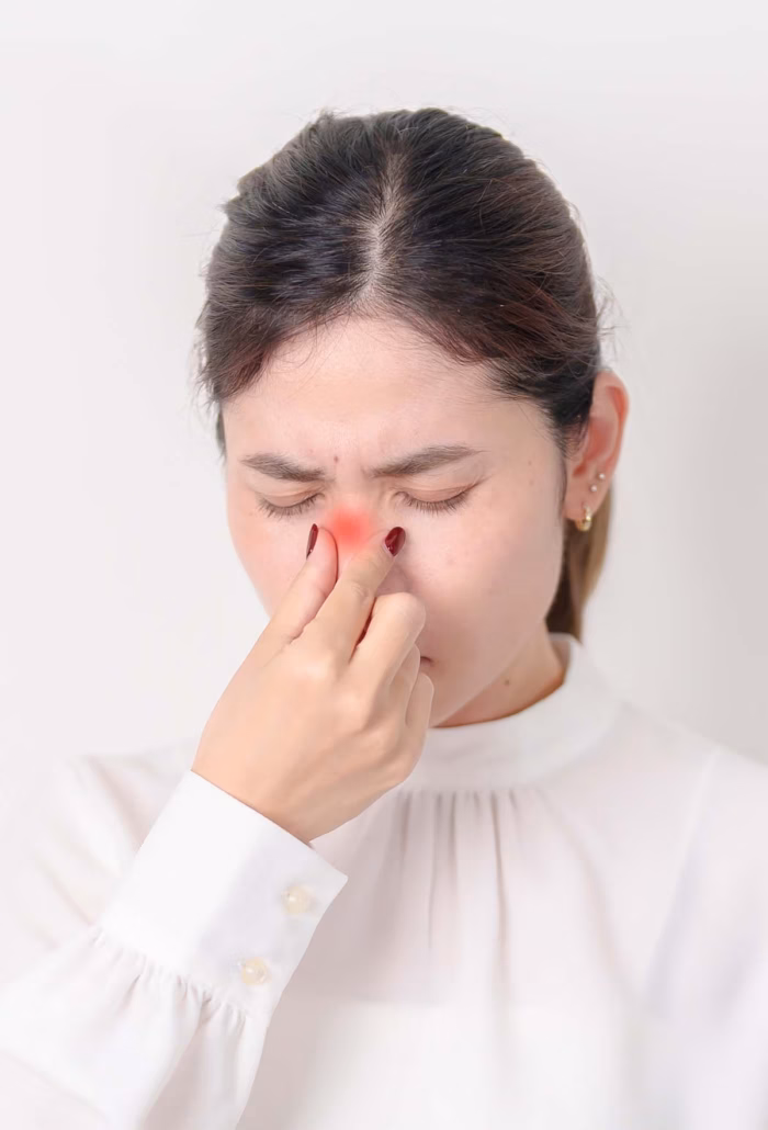 Patient with sinus pain seeking ENT urgent care for same-day evaluation and treatment of nasal symptoms.